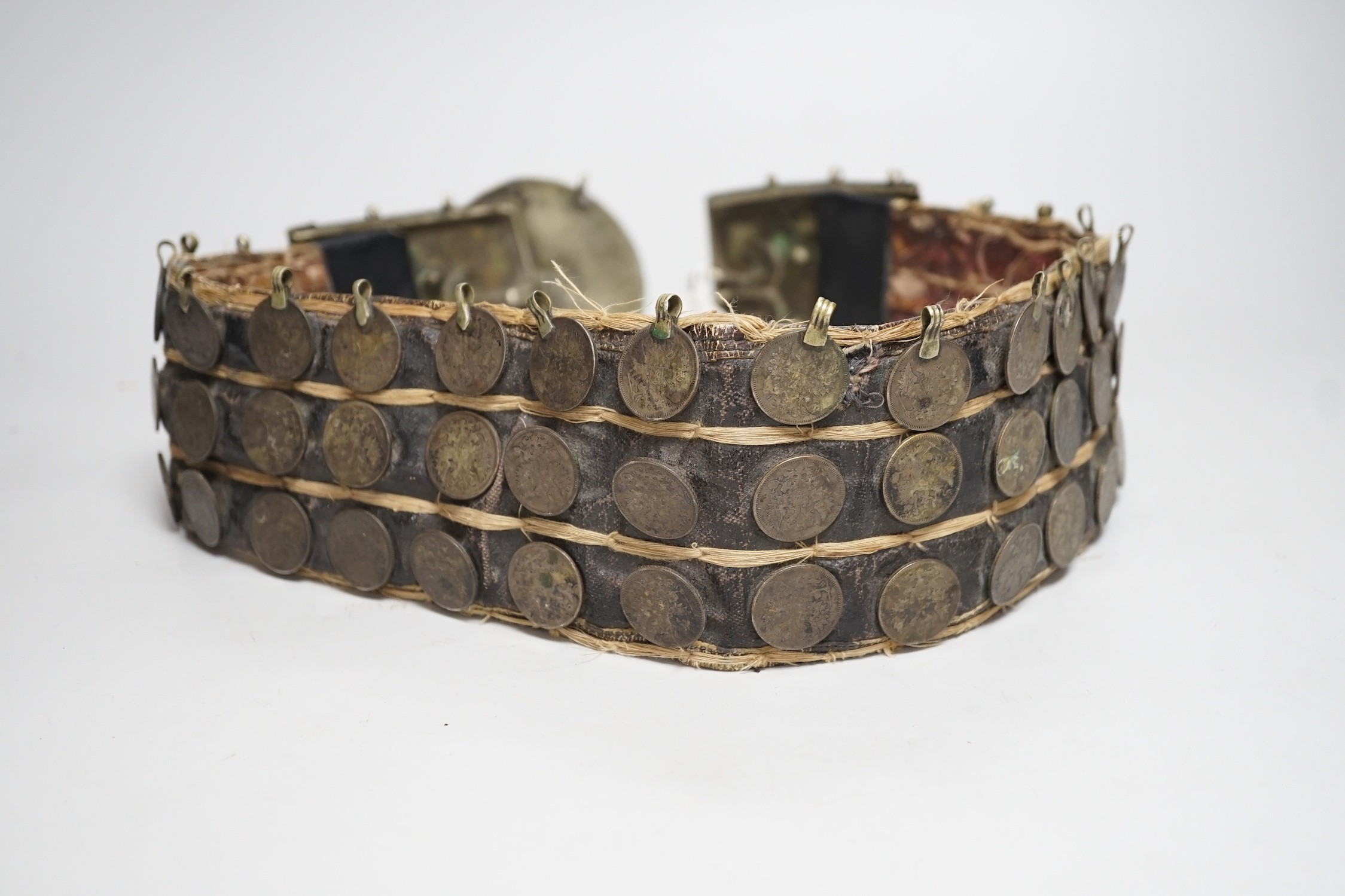 A 19th century Afghan belt, Russian coin mounted